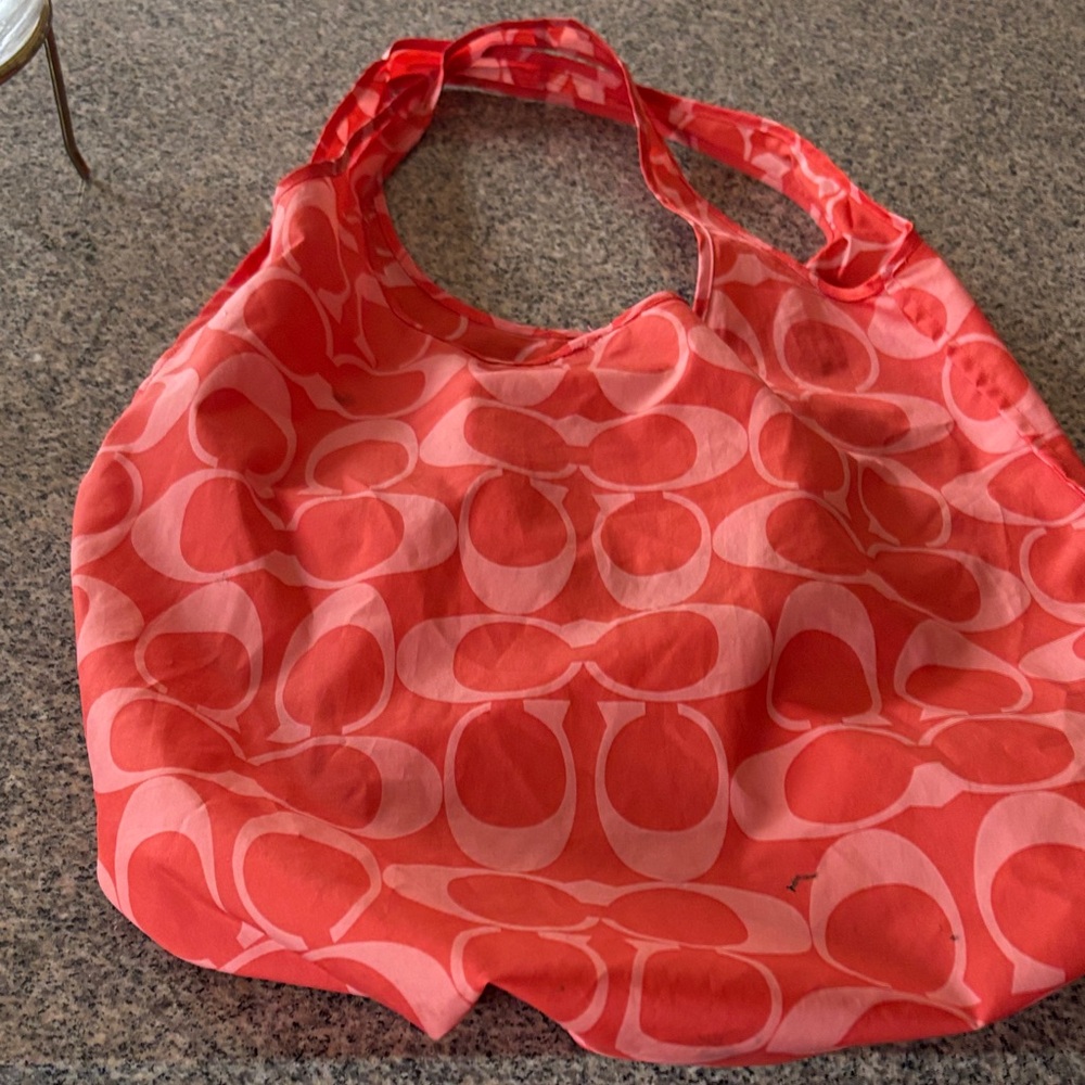 Coach tote 
Can fold into zipper compartment